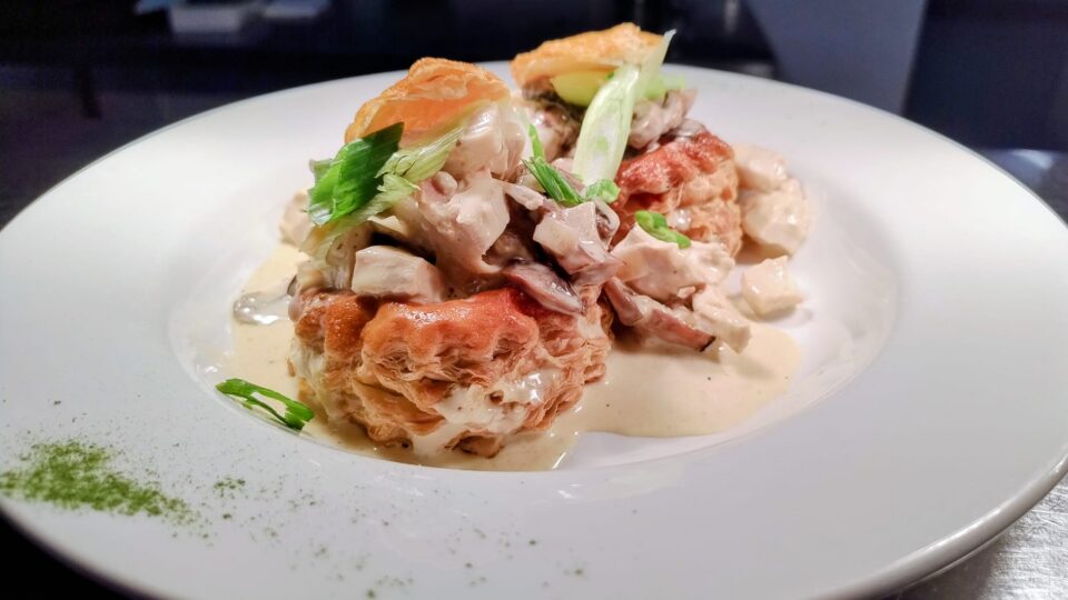 Savoury chicken vol-au-vent with creamy sauce and fresh herbs, offering a fine dining experience at our luxury hotel restaurant.